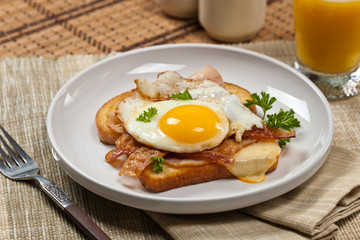 Sandwich with fried eggs - Croque Madame. Selective focus.