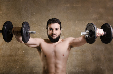Hipster lifting weights - obrazy, fototapety, plakaty