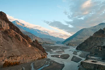 Papier Peint photo Népal Sunrise in a river Cali Gandaki valley