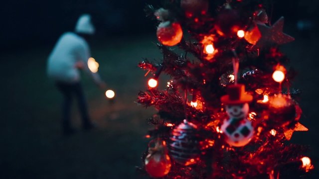 Teenager girl decorating the Christmas tree