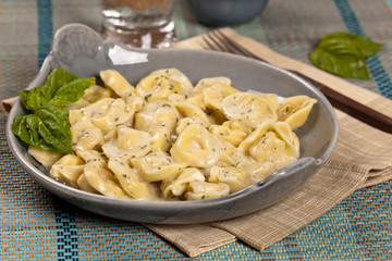 Creamy Tortellini Alfredo. Selective focus.