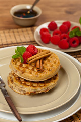 Waffles with raspberries and cinnamon. Selective focus.