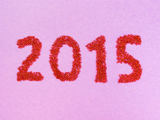 2015 sign made with beads on paper