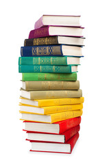 stack of colorful vintage books on white isolation