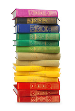 stack of colorful books in the textile cover on isolated white