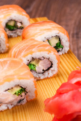 sushi roll set covered in salmon