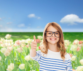 little girl with black eyeglasses