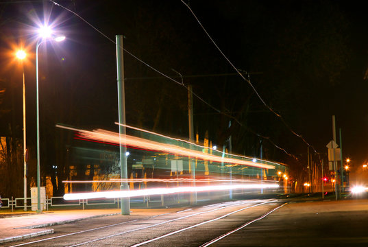 Evening traffic. The city lights. Abstract background. Tram