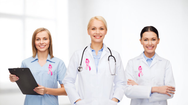 female doctors with breast cancer awareness ribbon