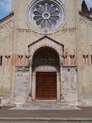 Red marble lions in front of the San Zeno In Verona