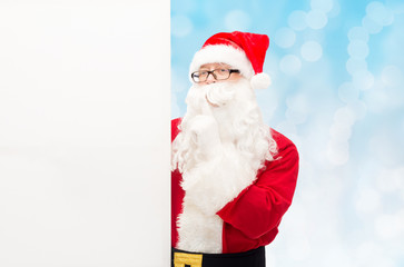 man in costume of santa claus with billboard