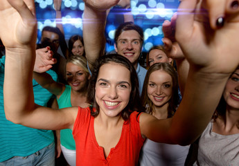smiling women dancing in club