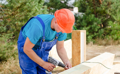 A carpenter working on a building site