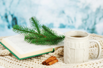 Cup of tea with book on table close-up