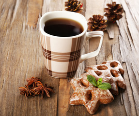 Cup of tea with cookies on table close-up