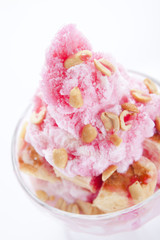 Shaved ice and bread with red syrup and sweet milk