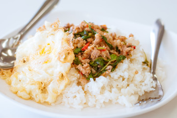 Rice topped with stir-fried pork and basil also Pad krapaw kaida
