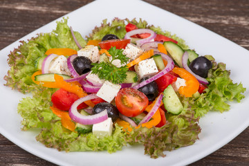 Fresh vegetable colorful greek salad in pate