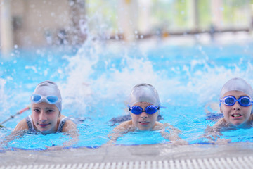 Fototapeta na wymiar children group at swimming pool