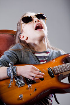 girl with guitar and sunglasses