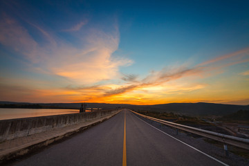 Fototapeta na wymiar The road and colorful sunset