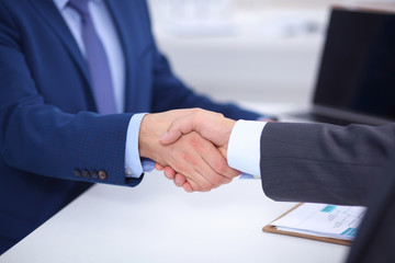 Business people shaking hands, finishing up a meeting