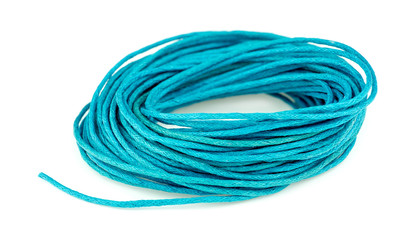 Blue twine in a bunched loop isolated on white