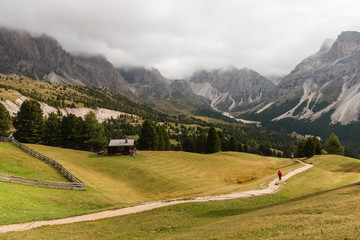 Fototapeta na wymiar walker on track in Dolomites