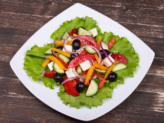 Fresh vegetable colorful greek salad in plate