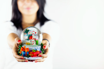 Blurry Woman Holds Snowman Sphere