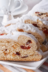 fruit cake German Stollen closeup on a plate. vertical