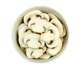 Bowl of juicy sliced mushrooms isolated against white