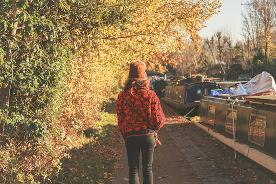 Woman walking by canal