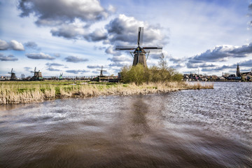  Dutch windmills with canal close the Amsterdam, Holland