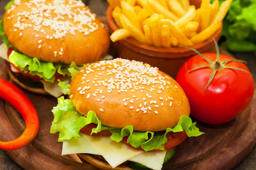 Hamburger with french fries and tomato