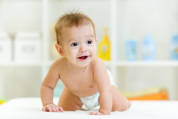 crawling funny baby boy at home