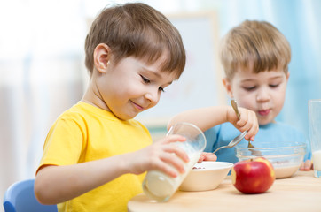 children eating healthy food at home