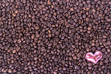 heart on the background of coffee beans