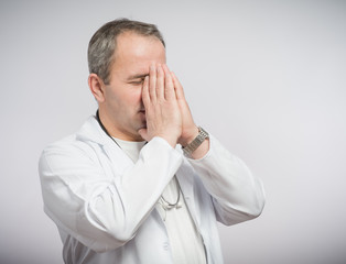 Doctor praying for help 