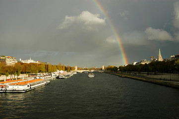 Naklejka na ściany i meble Rainbow on over river Seine at Paris on France