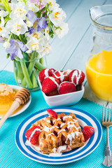  table view on spring breakfast with fresh flowers in vibrant co