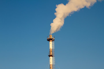 pipe with smoke from heating plant