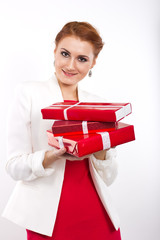 Young girl in red dress with gift red box