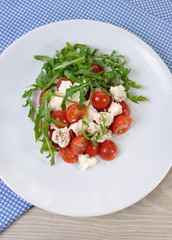 salad arugula with cherry tomatoes and mozzarella