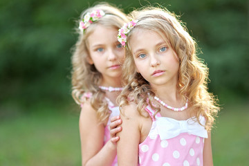 Portrait of two little girls twins