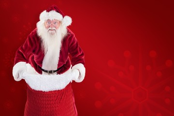 Composite image of santa open his red bag