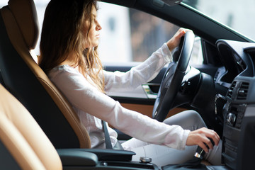 Young woman driving her car