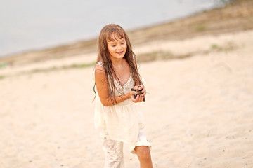 portrait of a little girl in summer nature