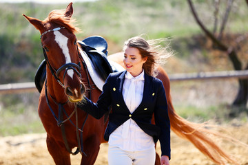 Obraz premium Beautiful girl with horse outdoors