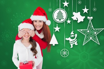 Composite image of mother and daughter with gift